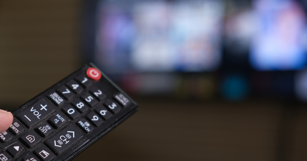 Image of TV blurred background with a TV remote