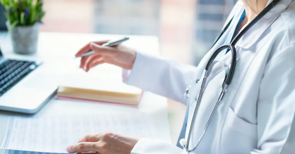 Doctor examining medical report